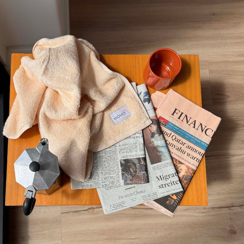 Close-up of beige bamboo hand towel on table – soft, absorbent and sustainable