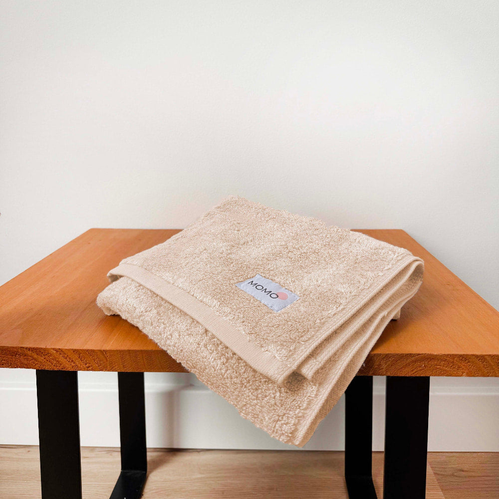 Beige bamboo hand towel on bench – soft, absorbent and sustainable